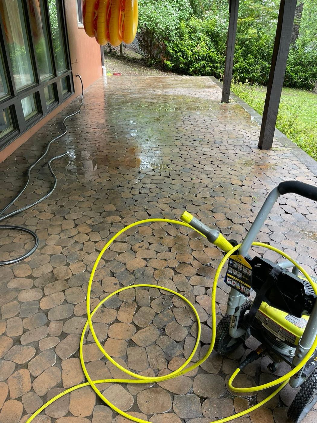 Power washing a stone patio